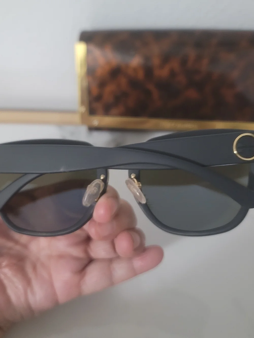 Tory Burch Black Frame Sunglasses with Blue Mirrored Lenses